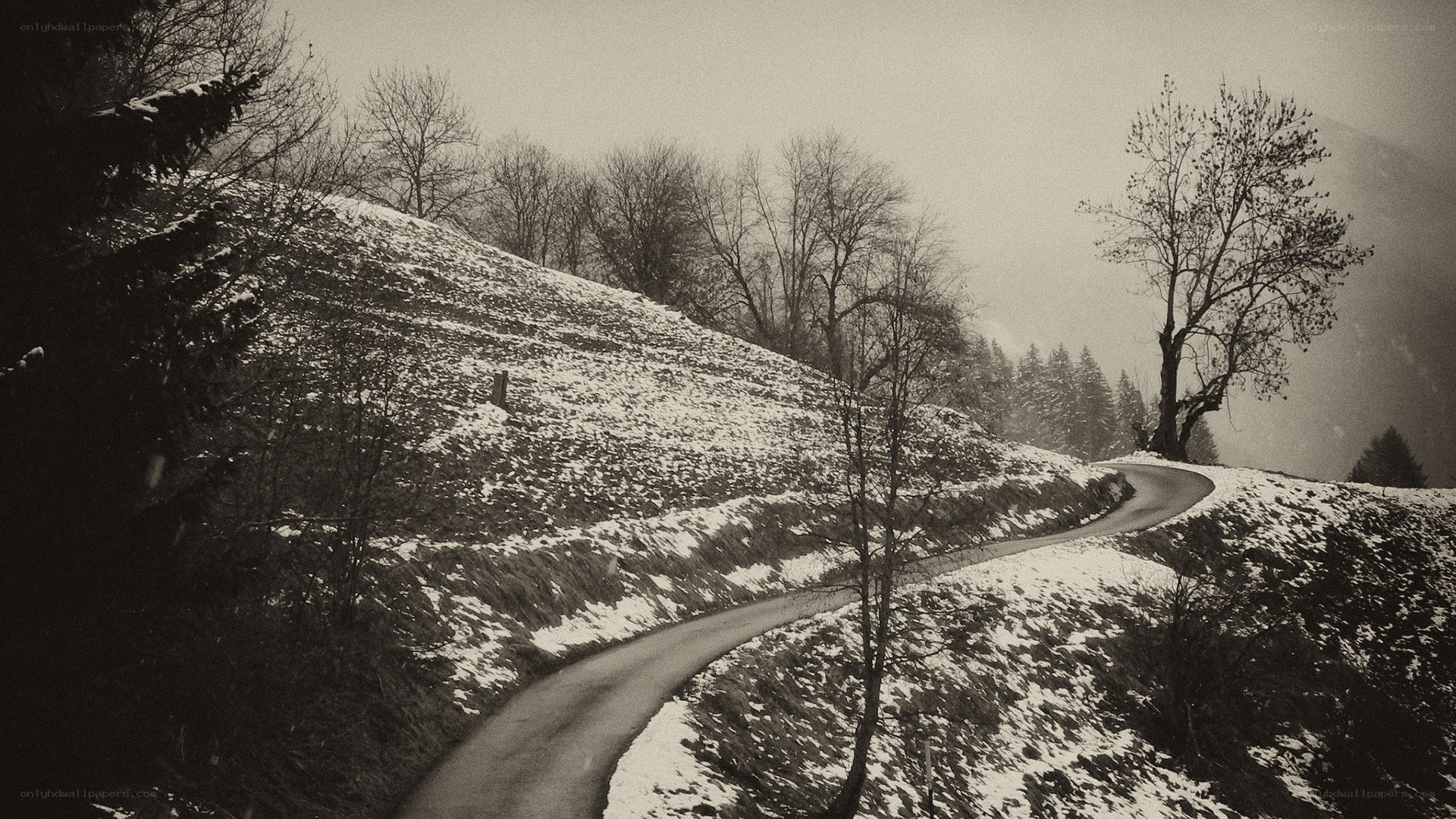 Winding road through snowy hills