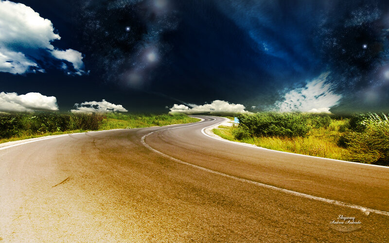 Winding road under starry sky