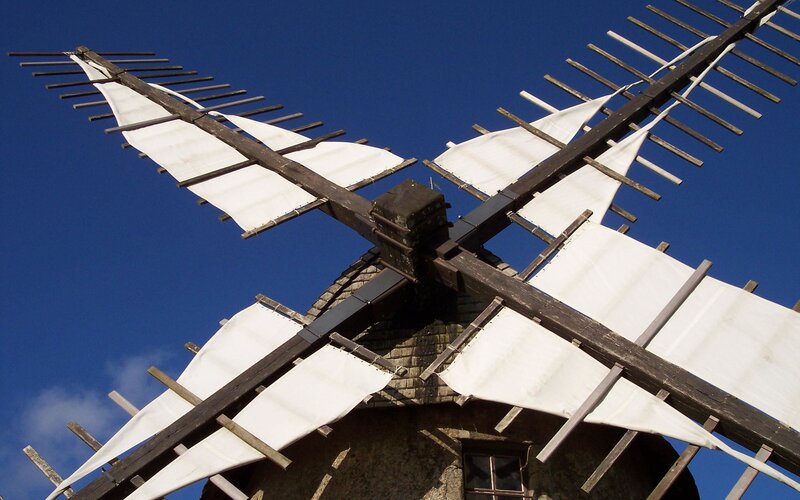 Windmill against blue sky