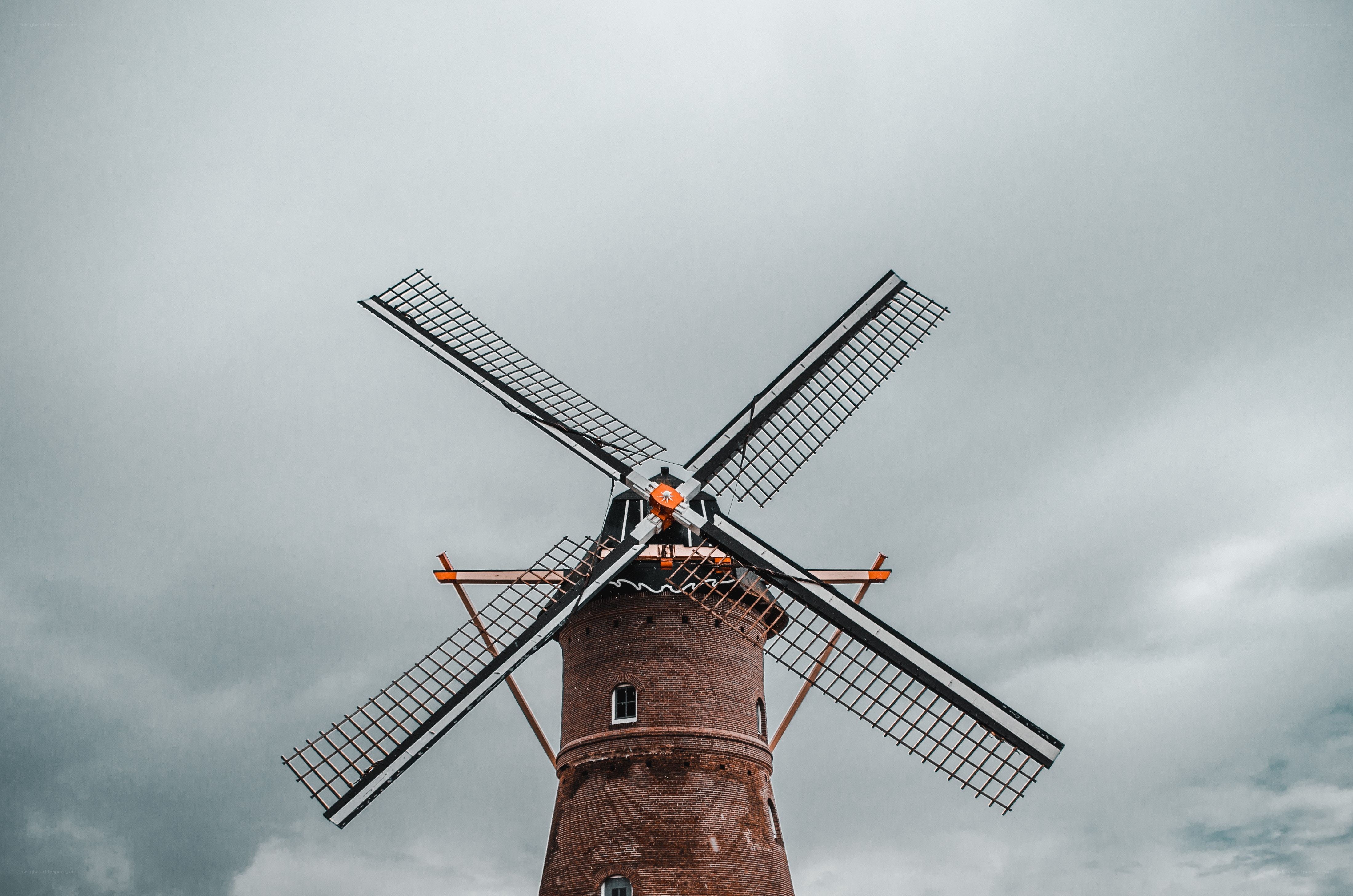 windmill against cloudy sky