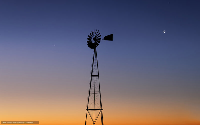Windmill at dusk with moon and stars
