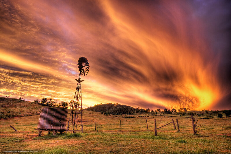 Windmill at sunset on a hill