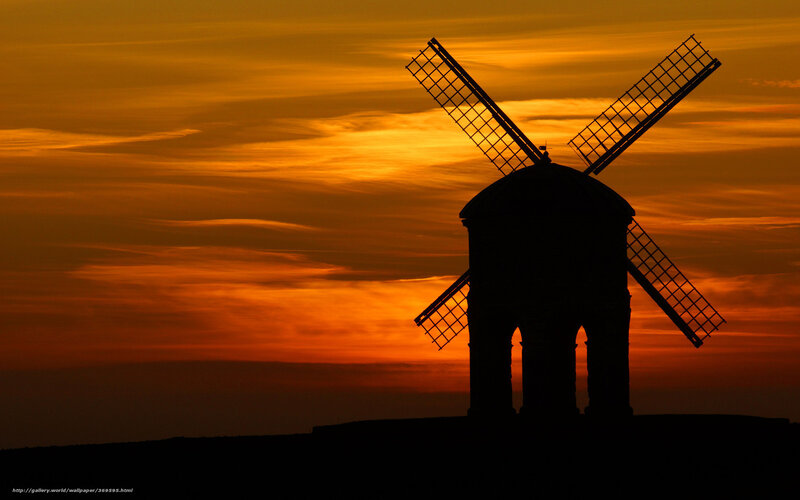 Windmill at sunset silhouette