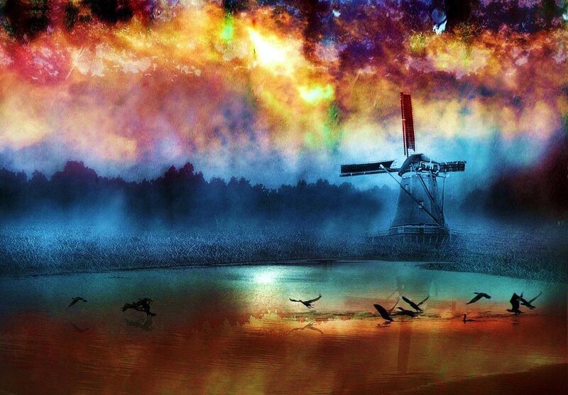 Windmill at sunset with birds