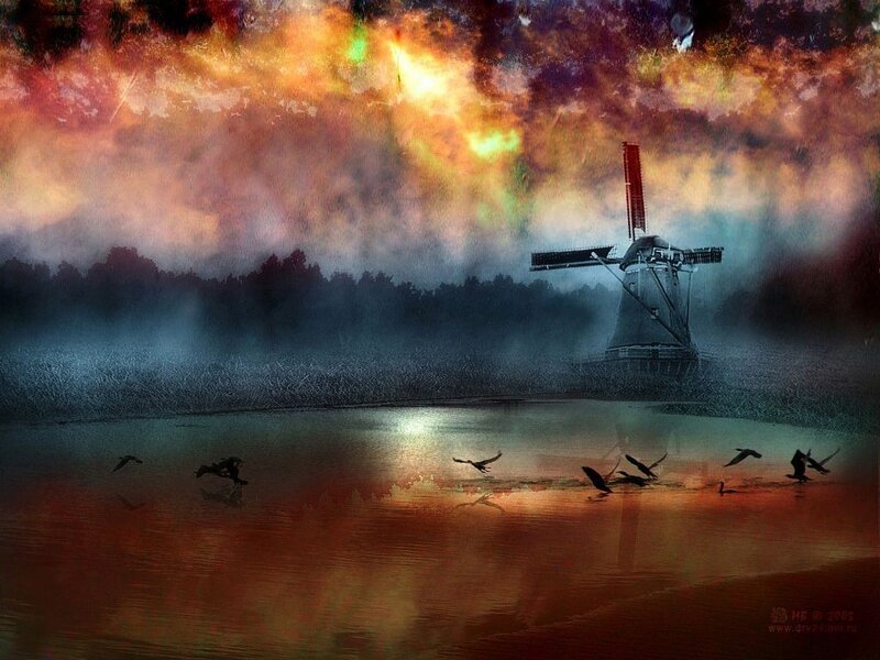 Windmill at sunset with birds