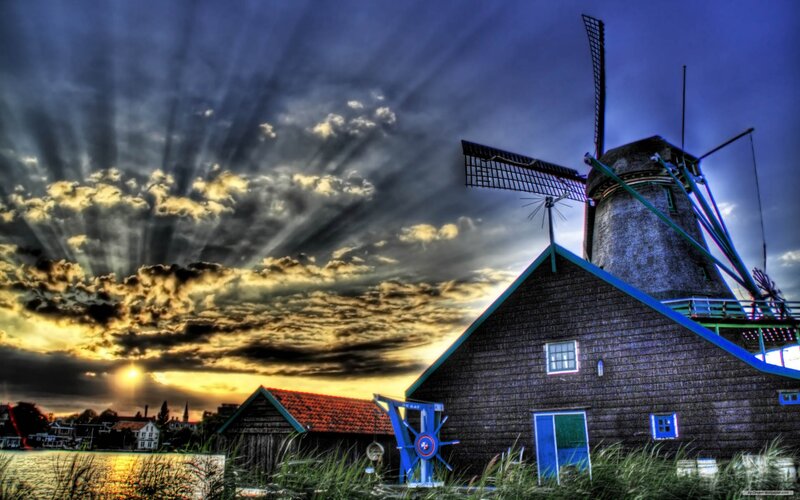 Windmill at sunset with dramatic sky
