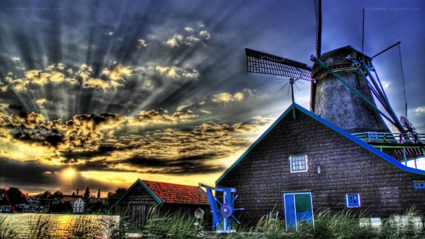 Windmill at sunset with dramatic sky