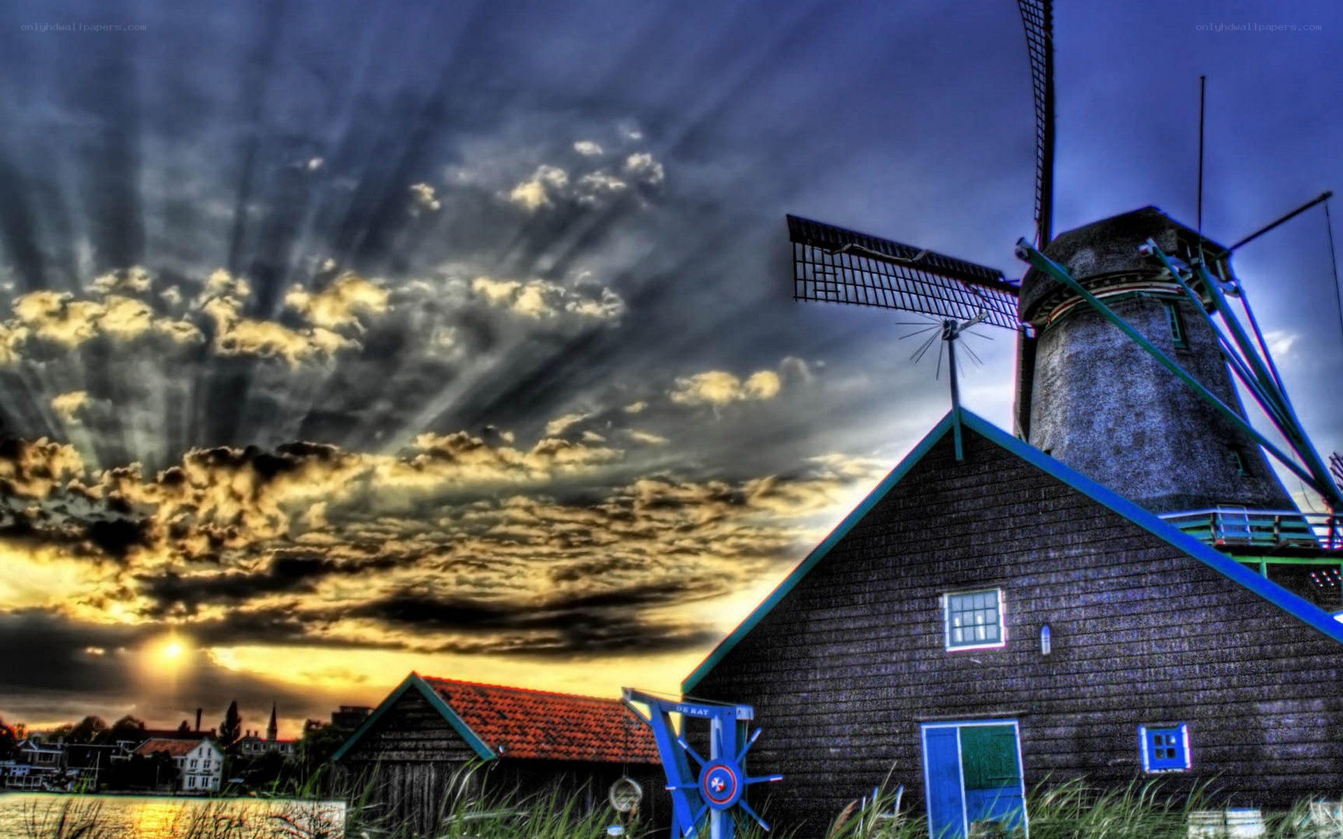 Windmill at sunset with dramatic sky