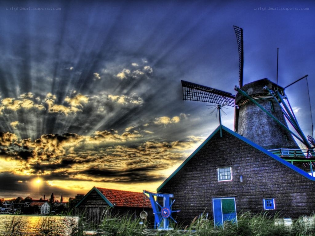 Windmill at sunset with dramatic sky