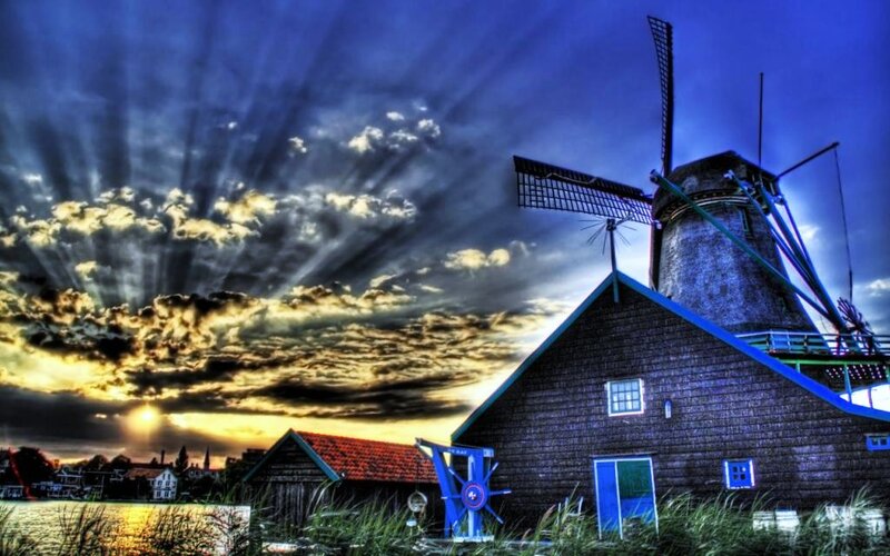 Windmill at sunset with dramatic sky