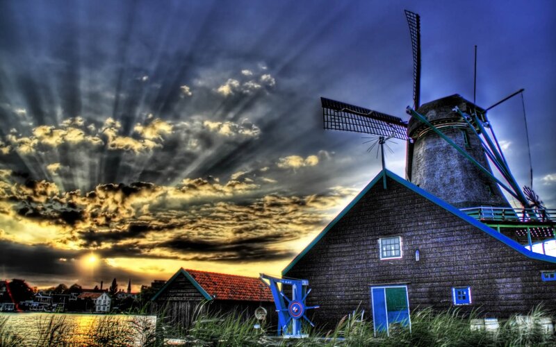 Windmill at sunset with dramatic sky