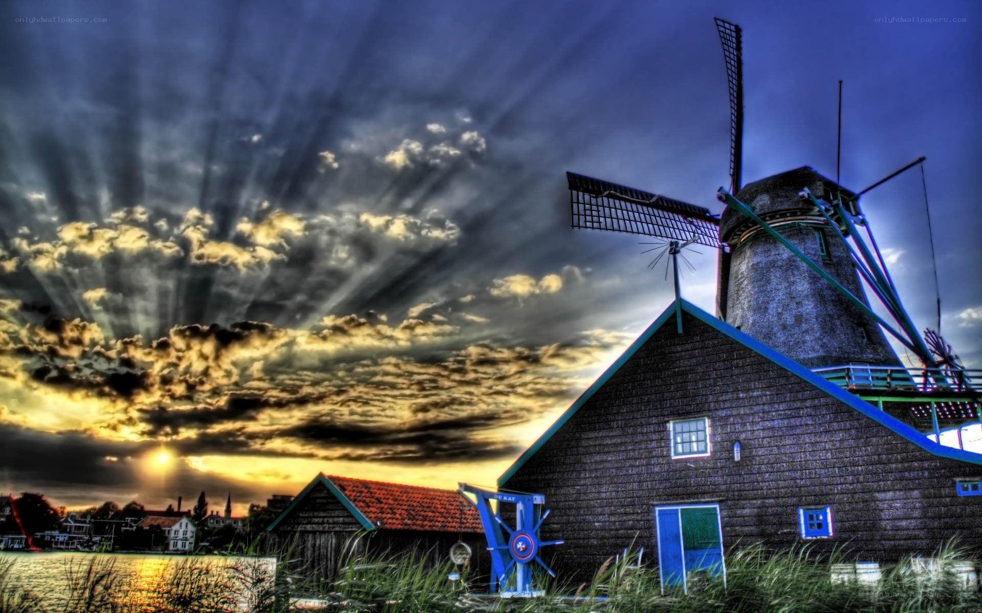 Windmill at sunset with dramatic sky