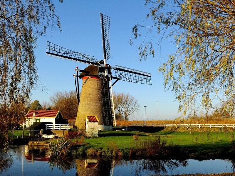Windmill by a Canal — Blue, Serene, Afternoon