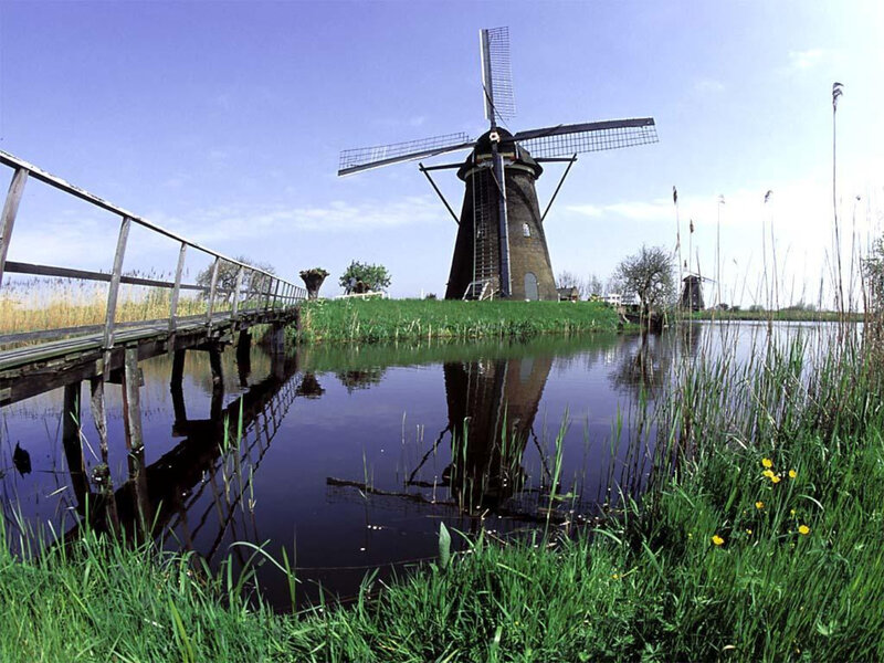 Windmill by a canal in the Netherlands