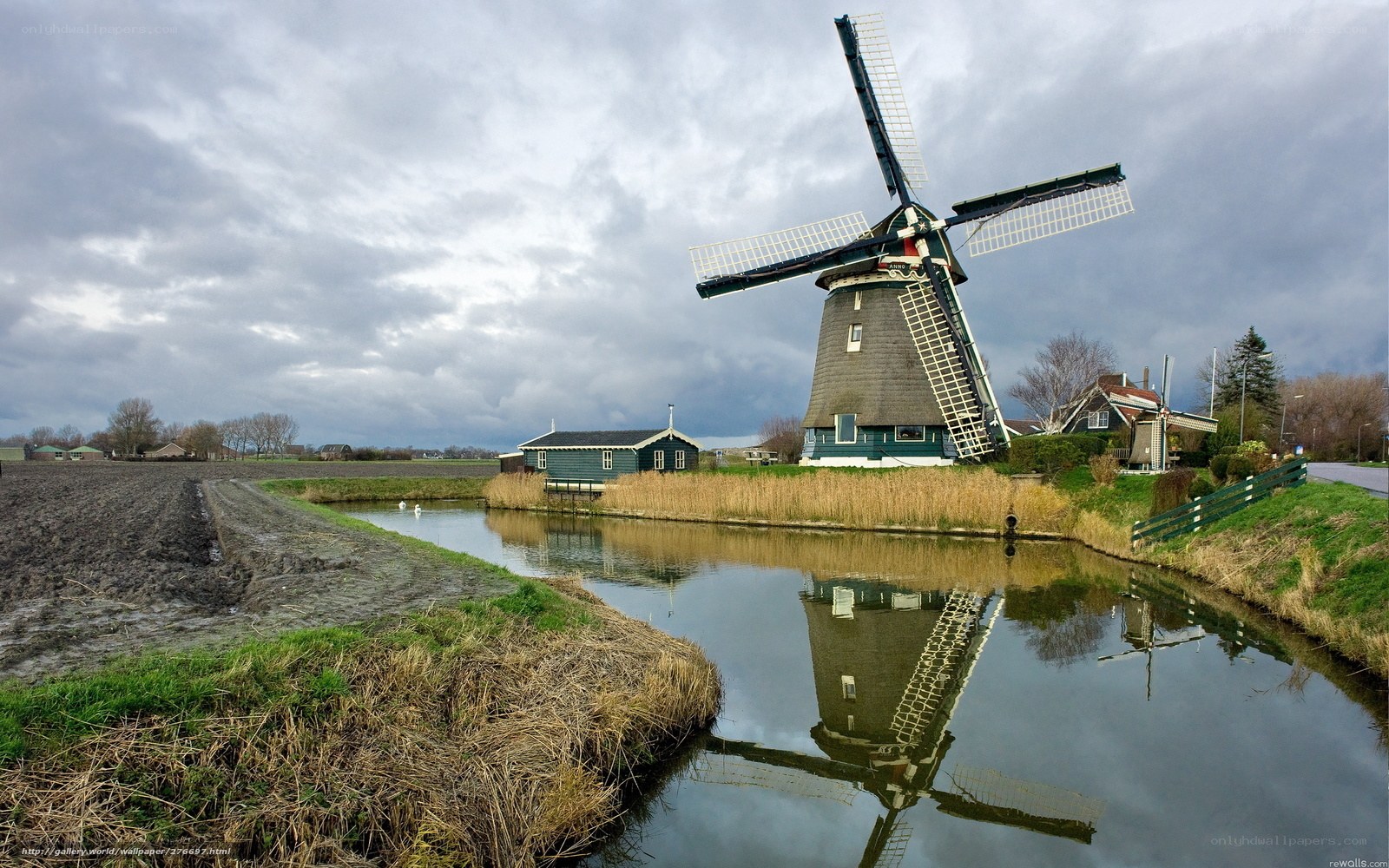 Windmill by a canal in the Netherlands