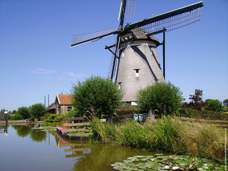 Windmill by a canal in the Netherlands