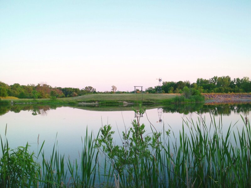 Windmill by a Pond