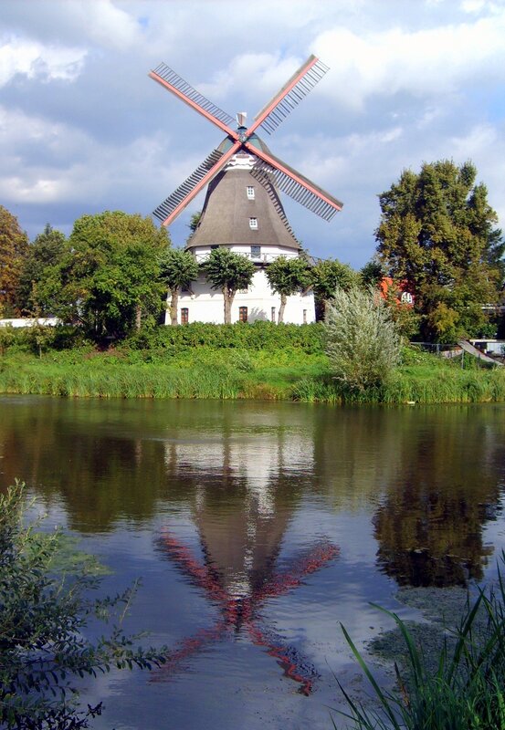 Windmill by a river