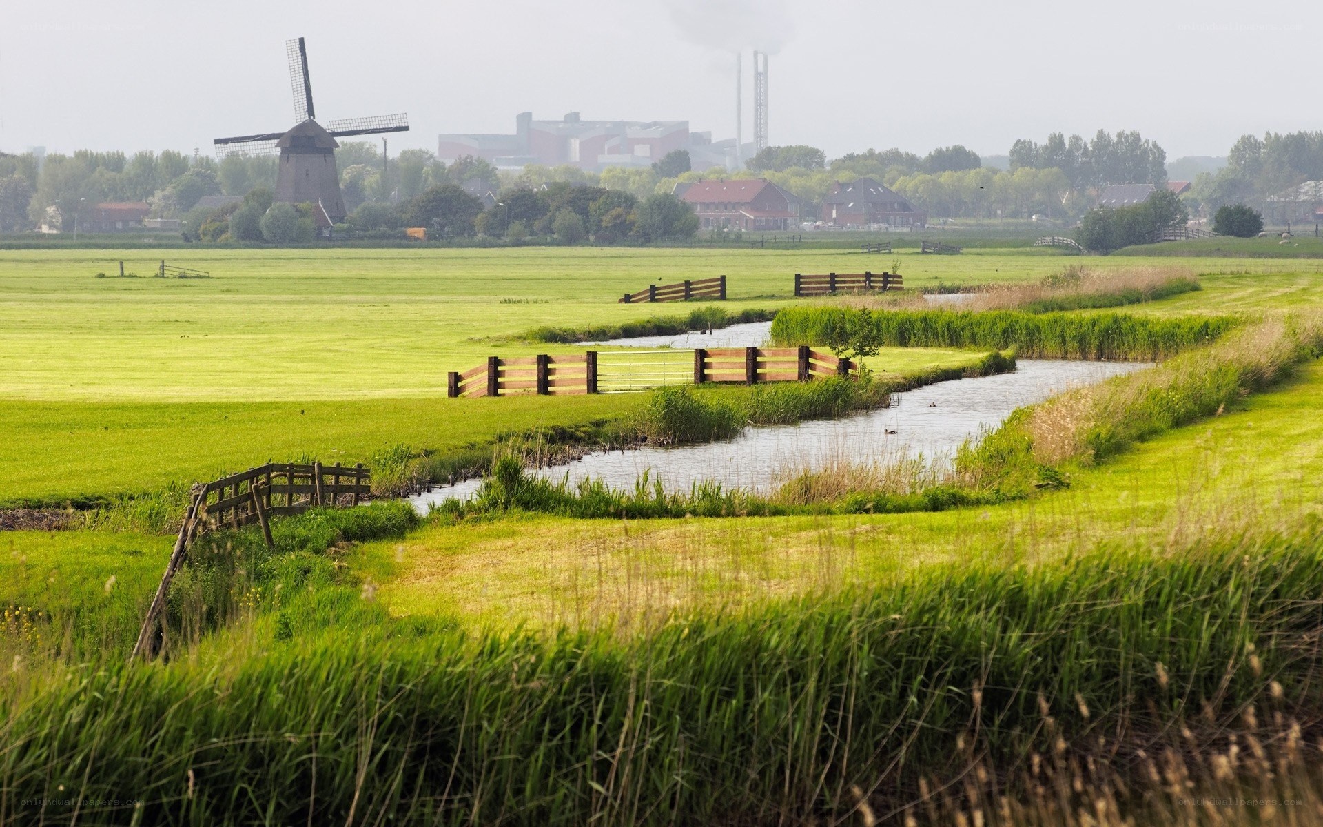 Windmill by a river in the Netherlands