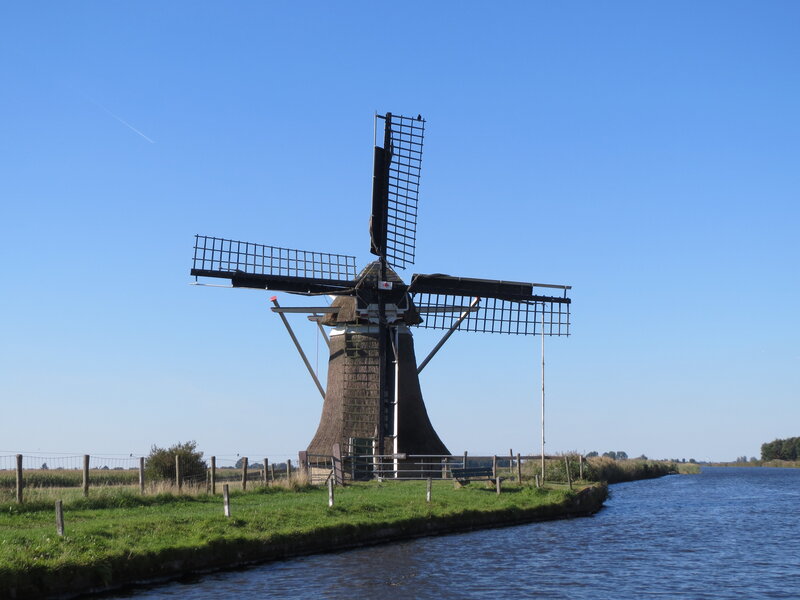 Windmill by Canal — Blue, Serene, Afternoon, Photograph, Grass