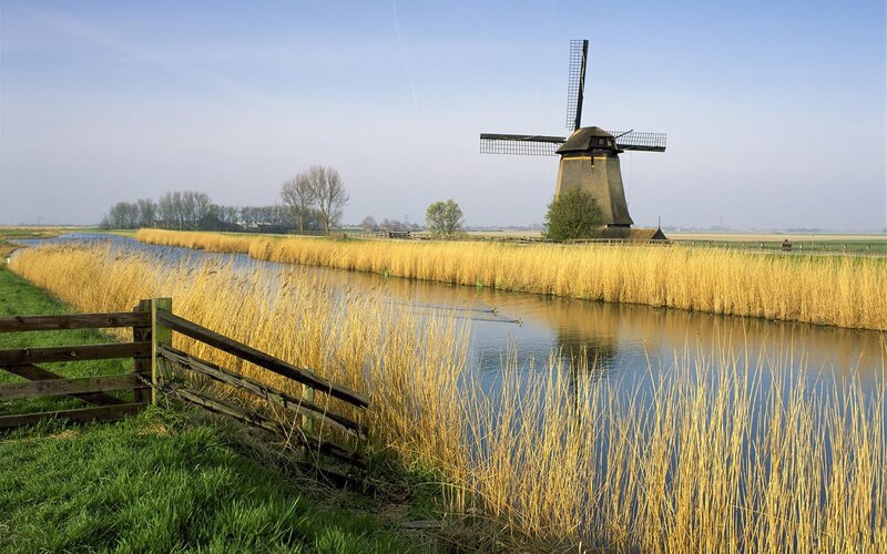 Windmill by Canal — Blue, Serene, Afternoon, Photograph