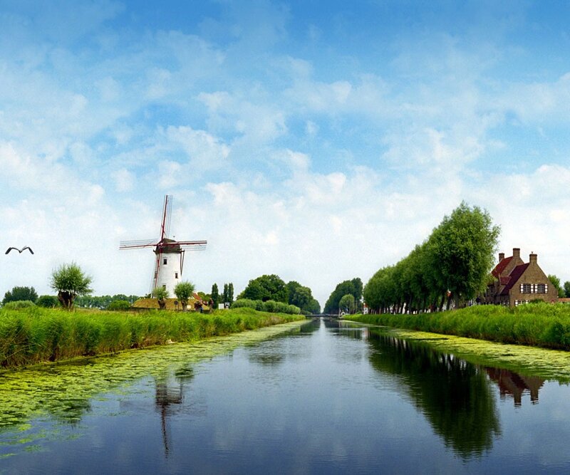 Windmill by Canal — Blue, Serene, Afternoon, Photograph, Trees, House