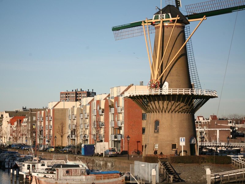 Windmill by the canal in Amsterdam
