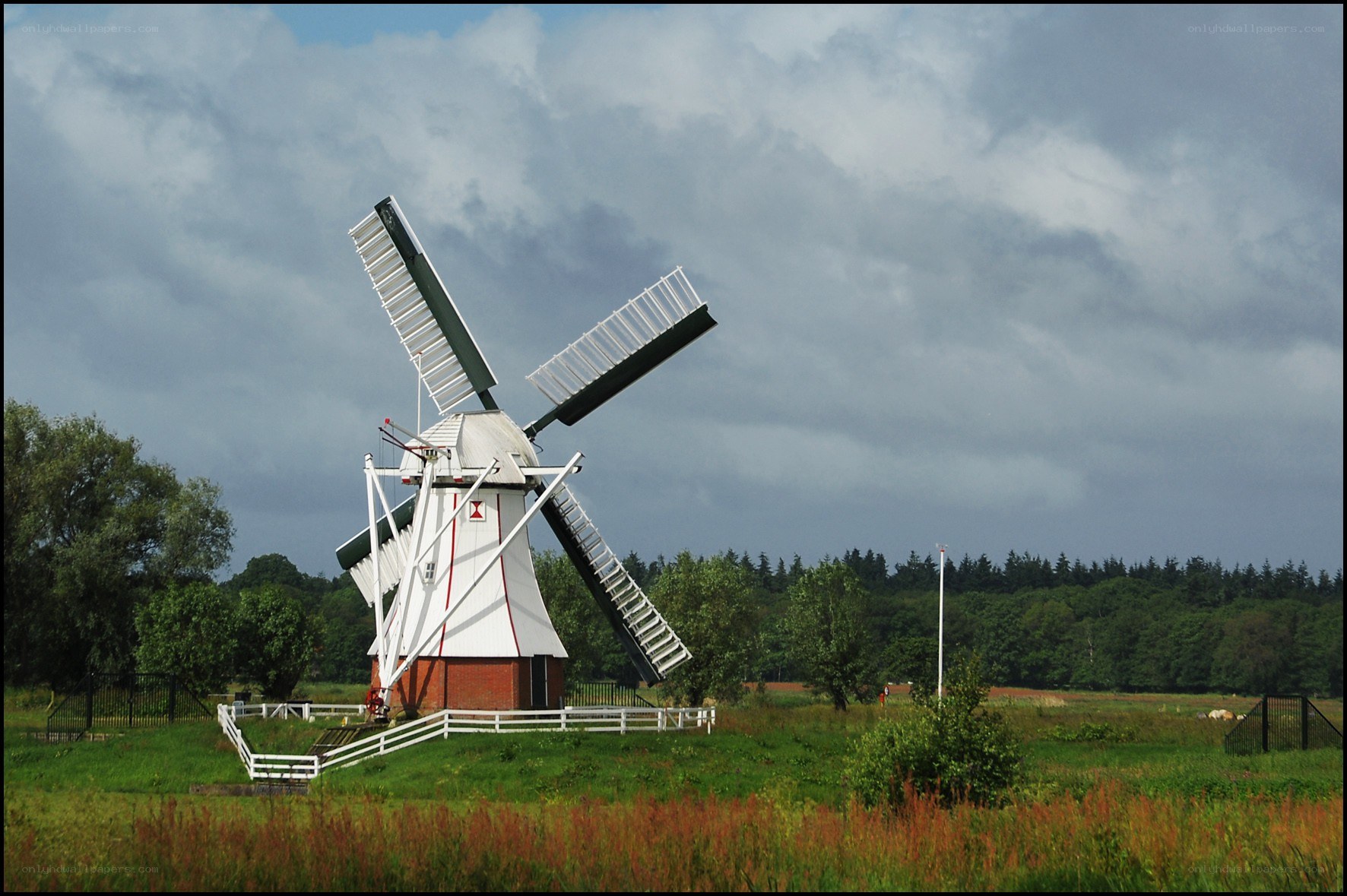 Windmill in a green field