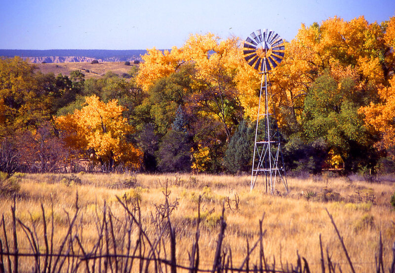 Windmill in autumn landscape