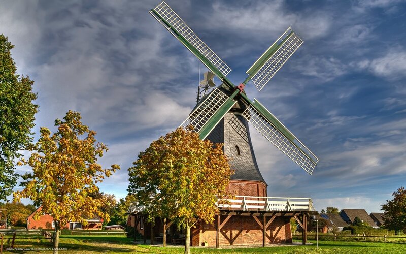 Windmill in autumn landscape