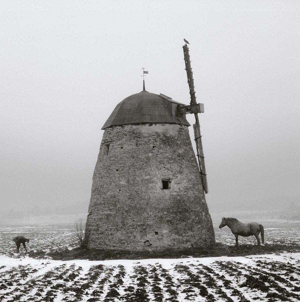 Windmill in snowy field