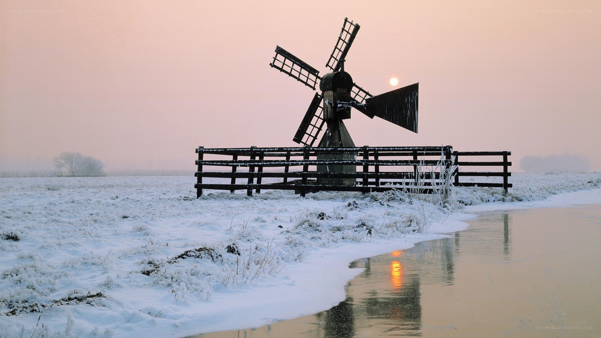 Windmill in snowy landscape