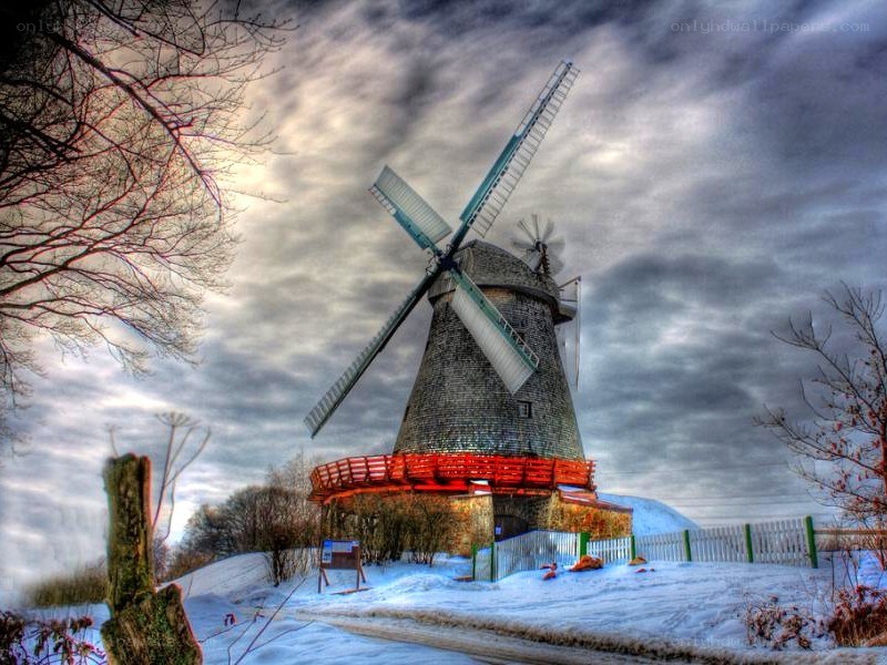 Windmill in snowy landscape