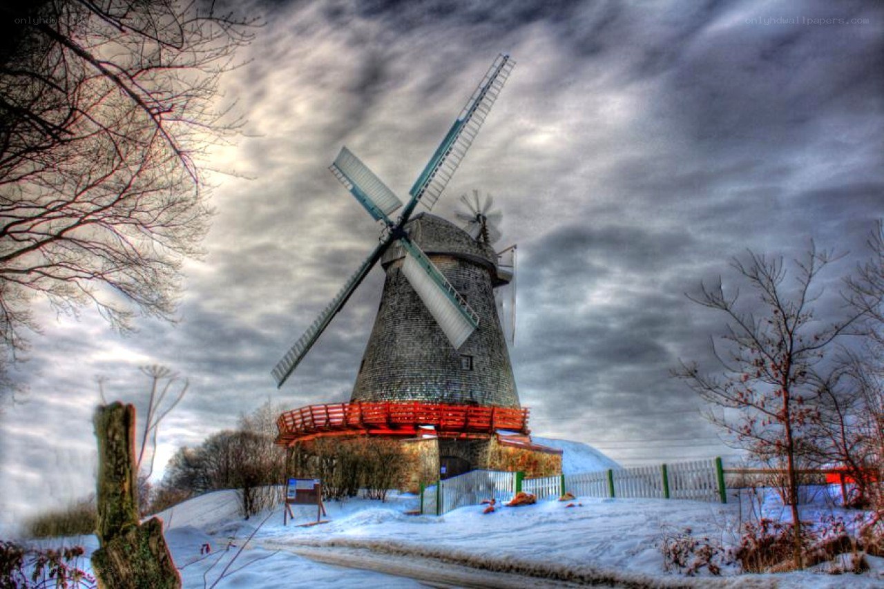 Windmill in snowy landscape