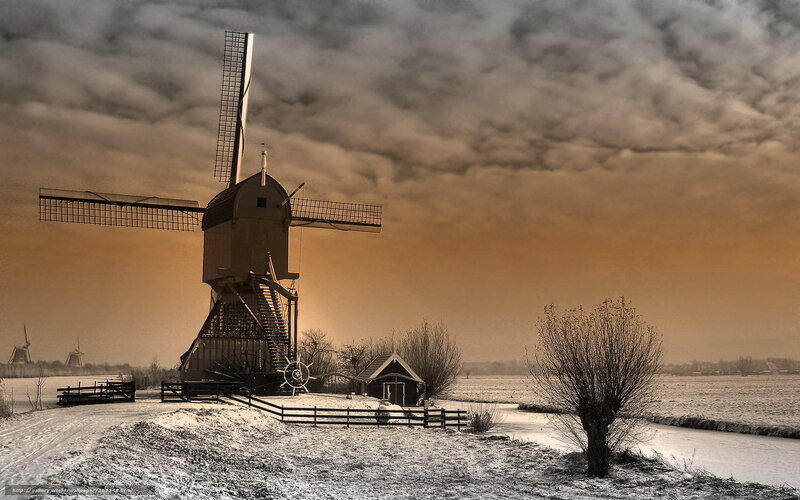 Windmill in snowy landscape