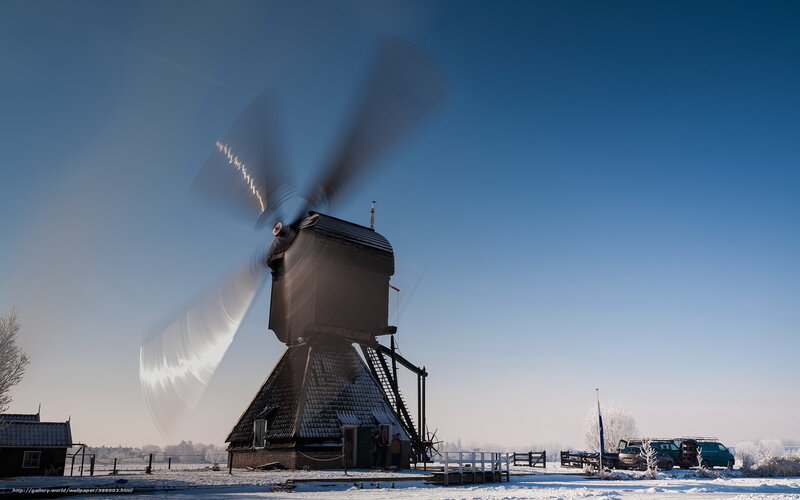 Windmill in winter landscape