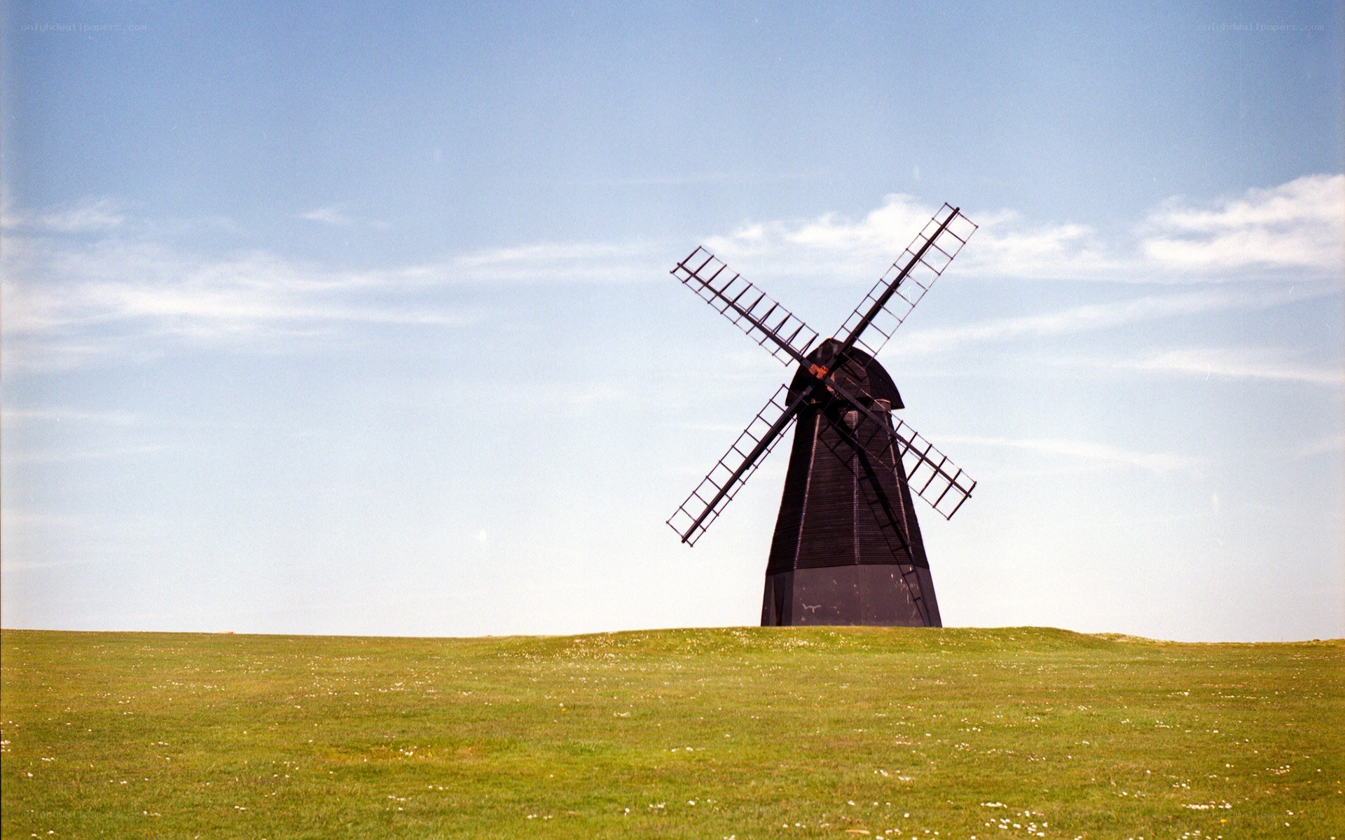 Windmill on a grassy hill