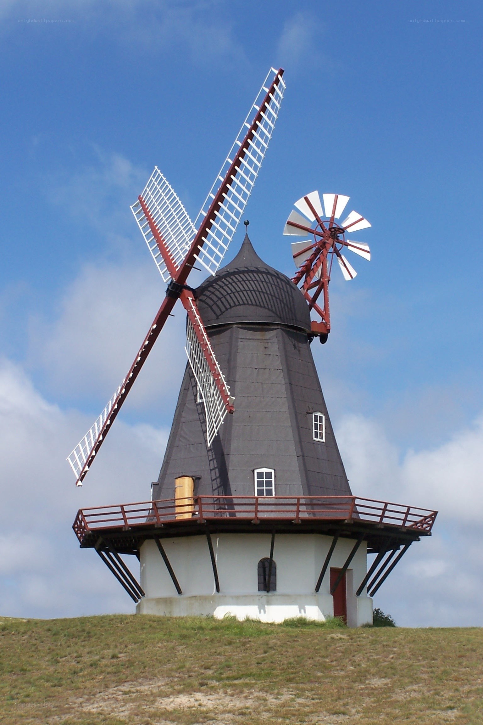 Windmill on a grassy hill