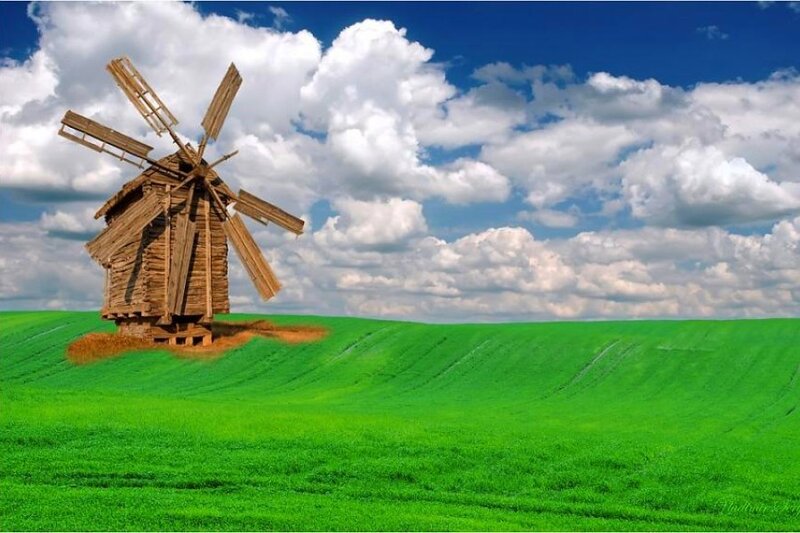 Windmill on a green hill