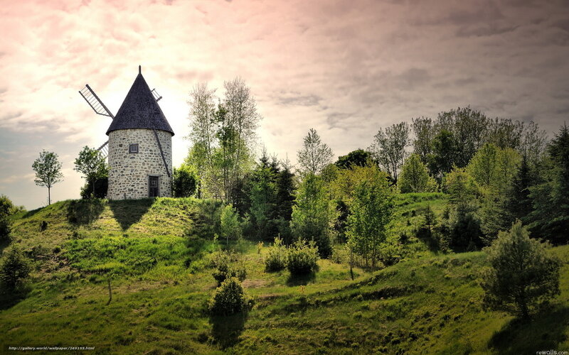 Windmill on a green hill