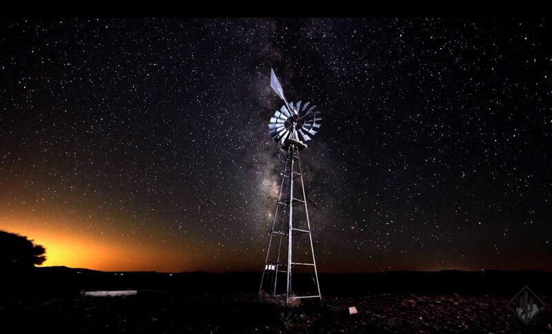 Windmill under starry sky