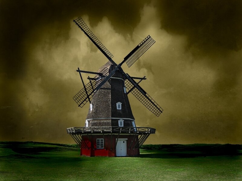 Windmill under stormy sky