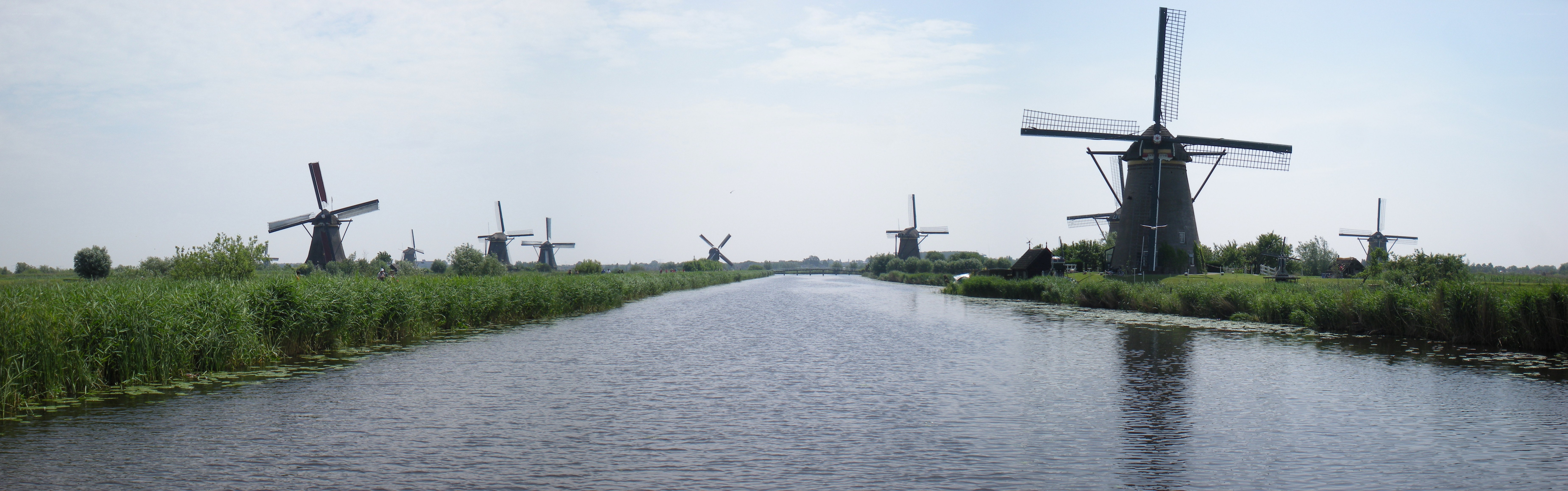 Windmills along a canal