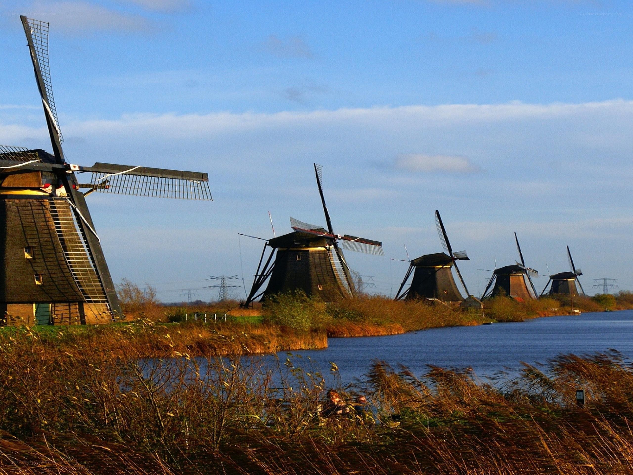Windmills along a canal