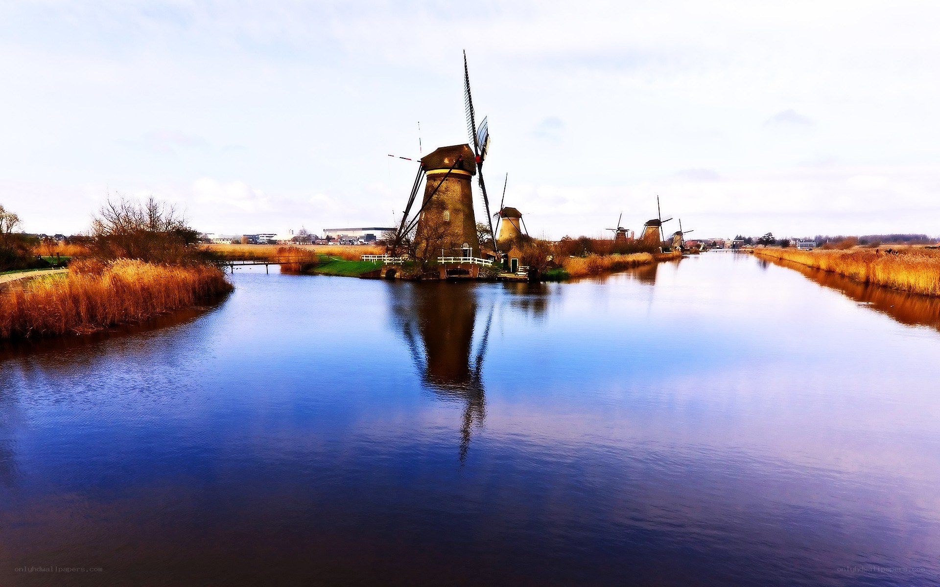 Windmills along a canal
