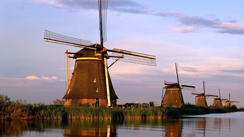 Windmills Along a Canal — Blue, Serene, Sunset, Photograph, Sky, Reeds