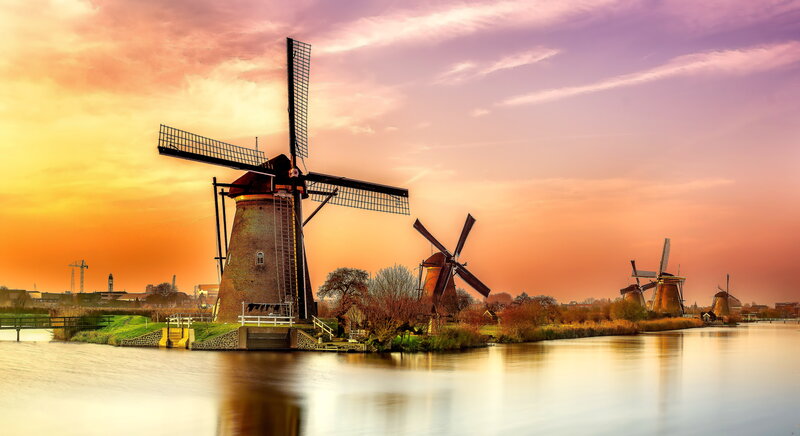 Windmills Along a Canal — Orange, Serene