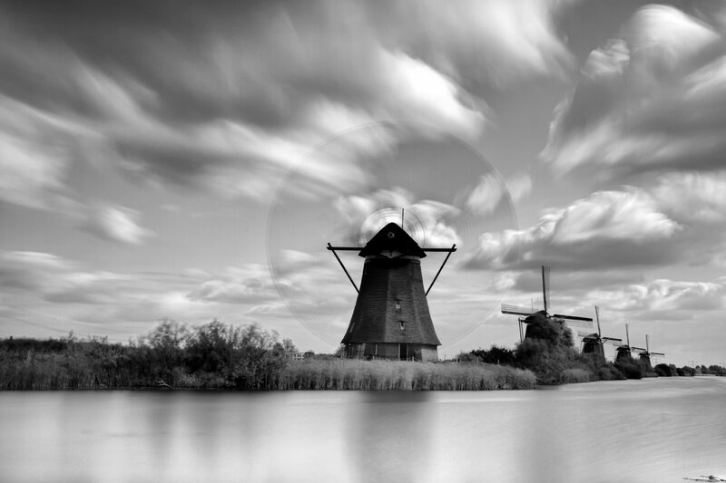 Windmills Along a River