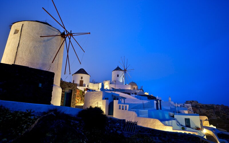 Windmills at dusk in Santorini