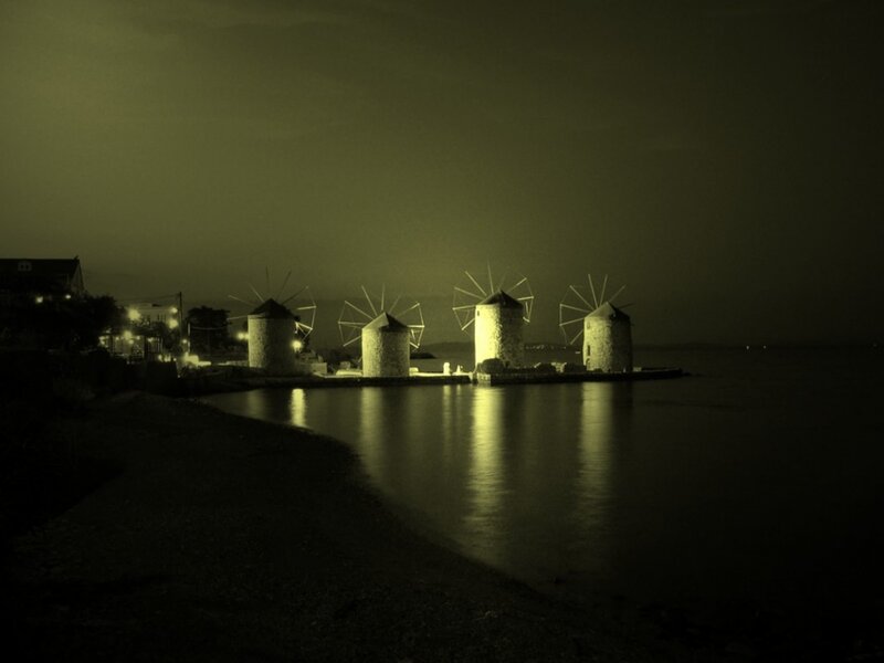 windmills at night by the sea